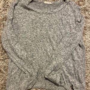 Long sleeve sweater with tie at the bottom